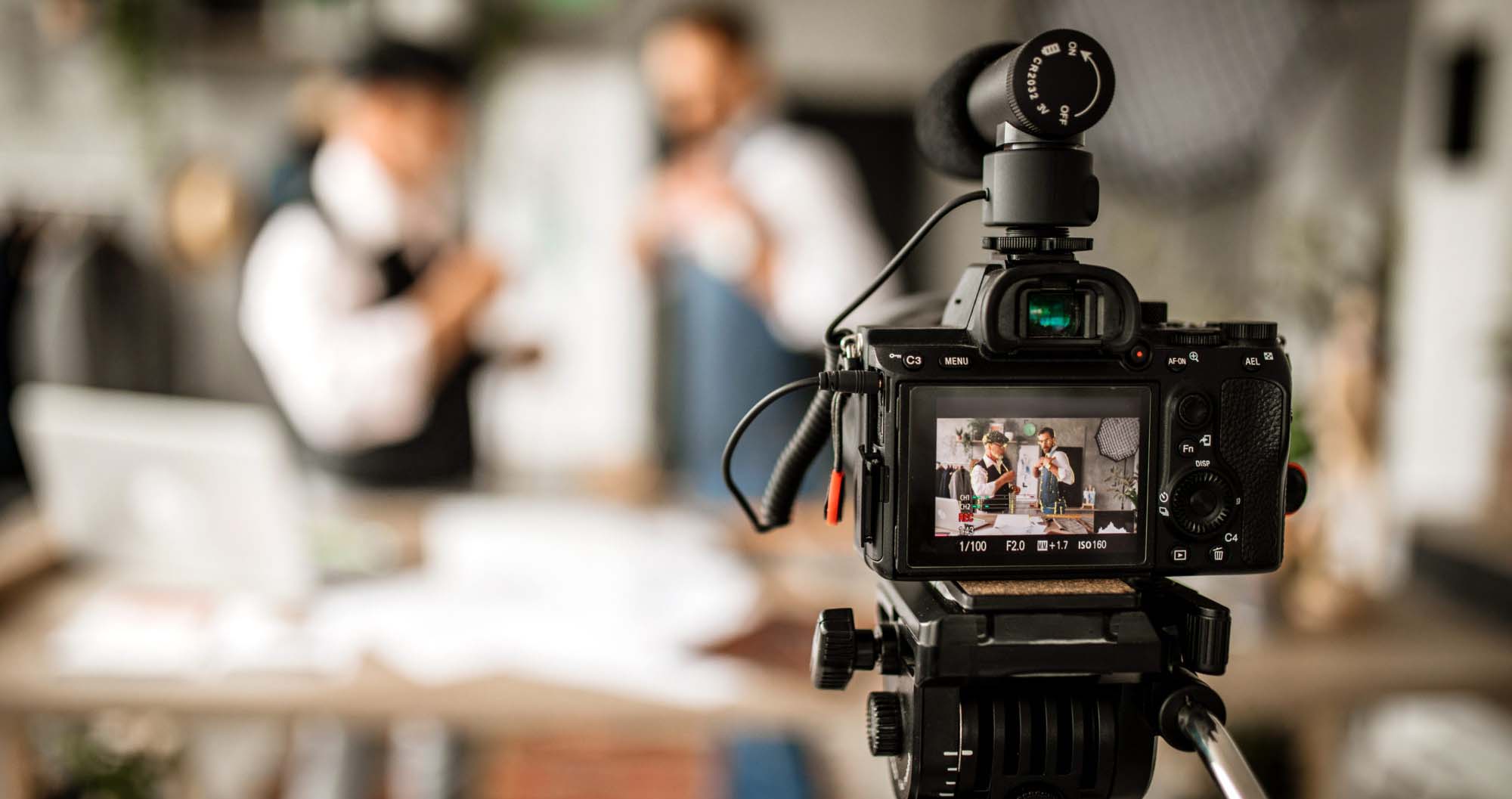 Two Fashion Designers Filming Fashion Internet Podcast in Fashion Design Studio